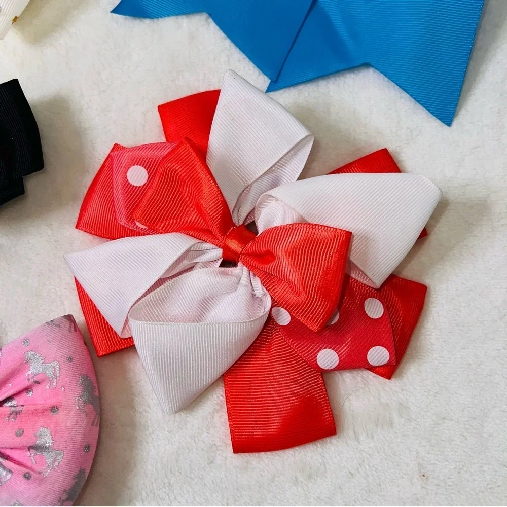 7 Cheerleader/Dance Bows Different Sizes, Colors & Holders. Missing Black Bow